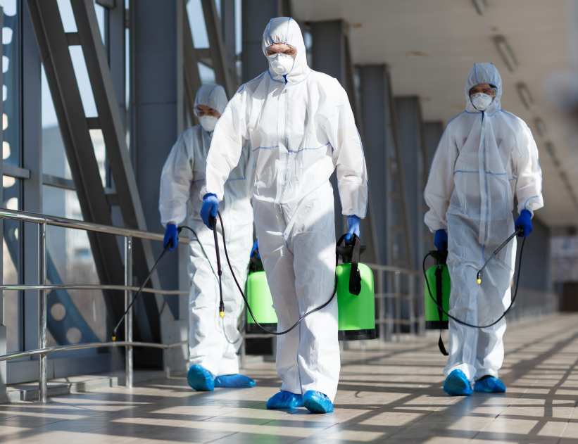 people-in-virus-protective-suits-and-mask-disinfect